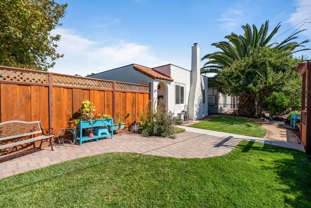 a view of a backyard with potted plants