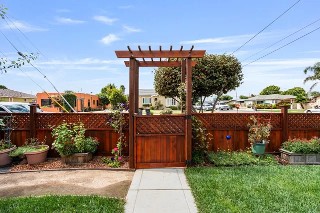 a view of a street with a bench in front of it