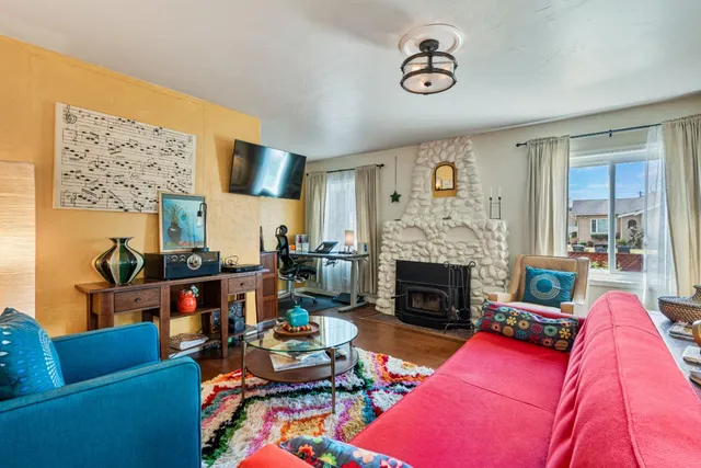 a living room with furniture and a fireplace