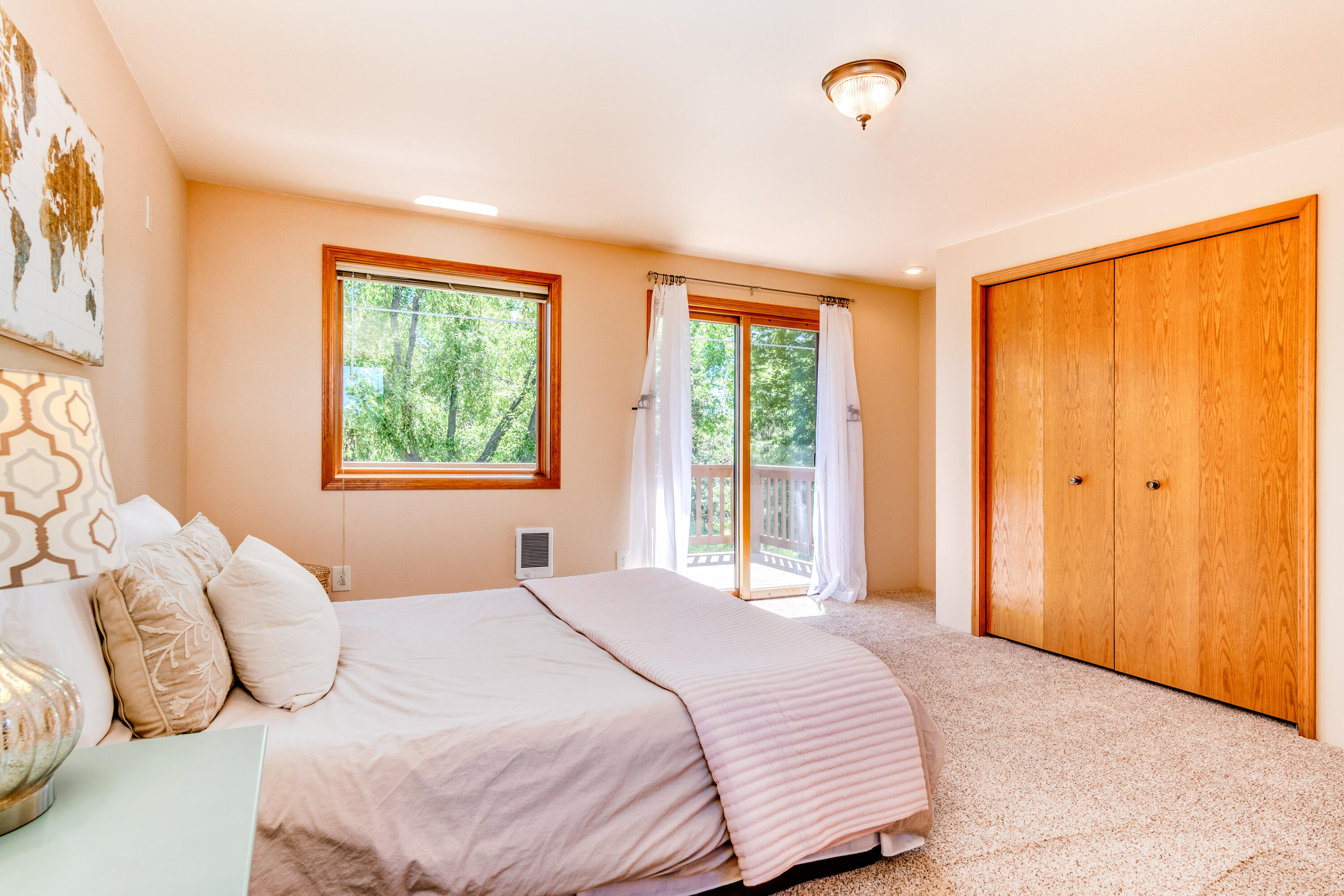 63536 Vogt Road Bend, OR 97701 - Photo 30 of 44 a bedroom with a bed and a window