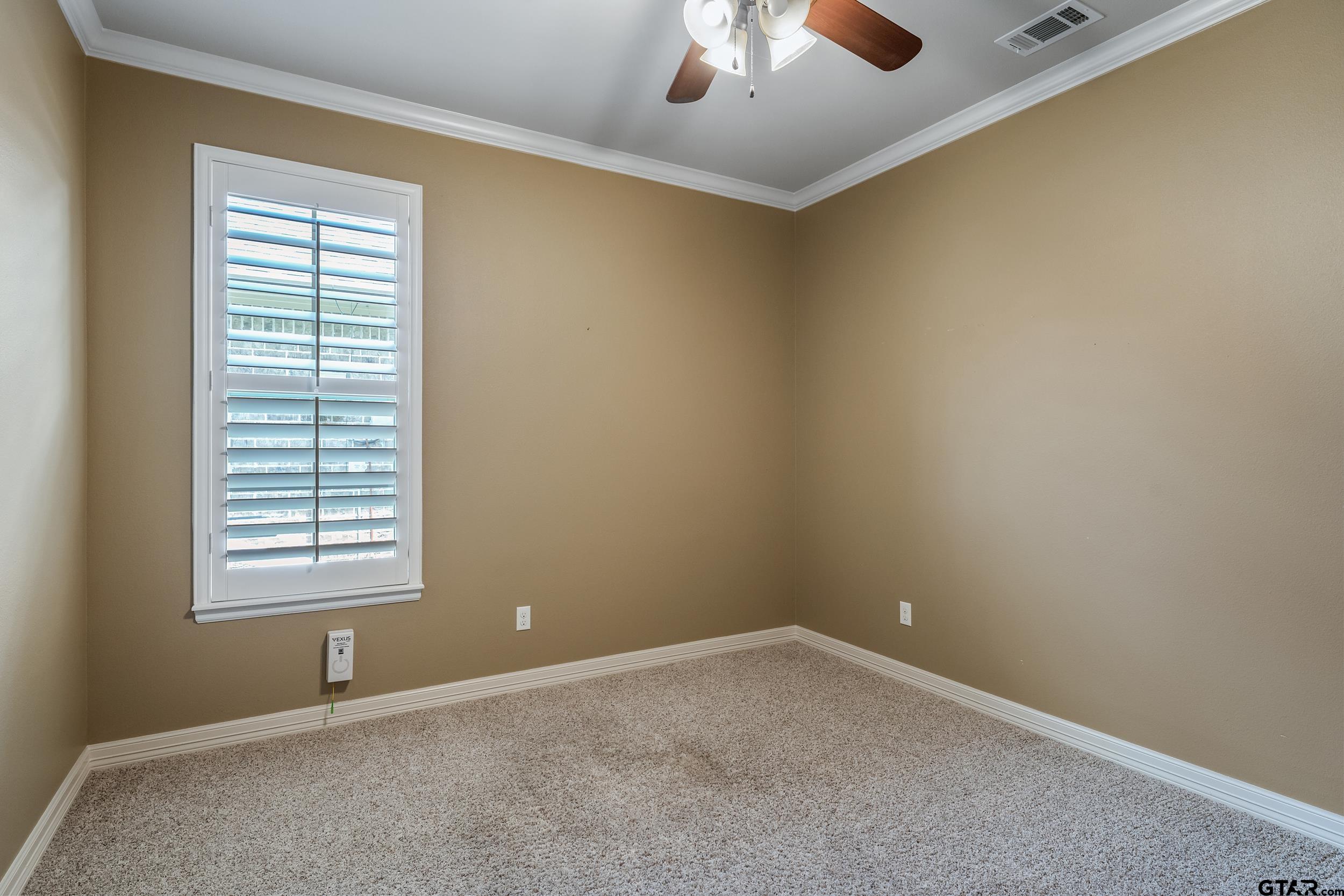 5524 Hollytree Drive Tyler, TX 75703 - Photo 22 of 27 an empty room with a window