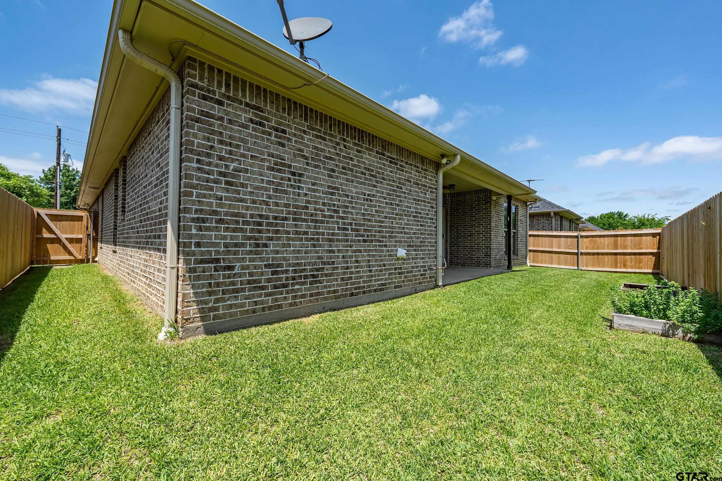 5524 Hollytree Drive Tyler, TX 75703 - Photo 26 of 27 a view of a backyard