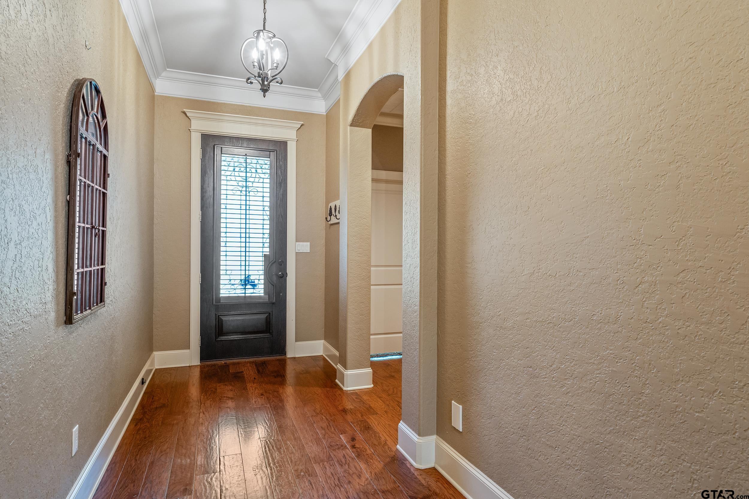 5524 Hollytree Drive Tyler, TX 75703 - Photo 5 of 27 a view of livingroom with hardwood floor and hallway