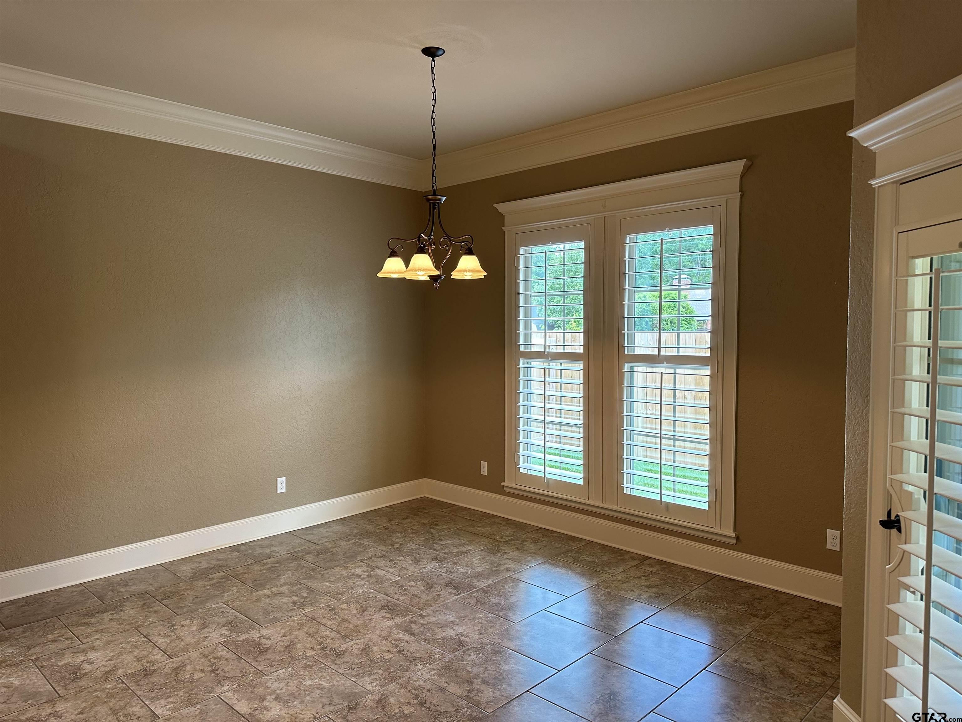 5524 Hollytree Drive Tyler, TX 75703 - Photo 9 of 27 a view of an empty room with a window