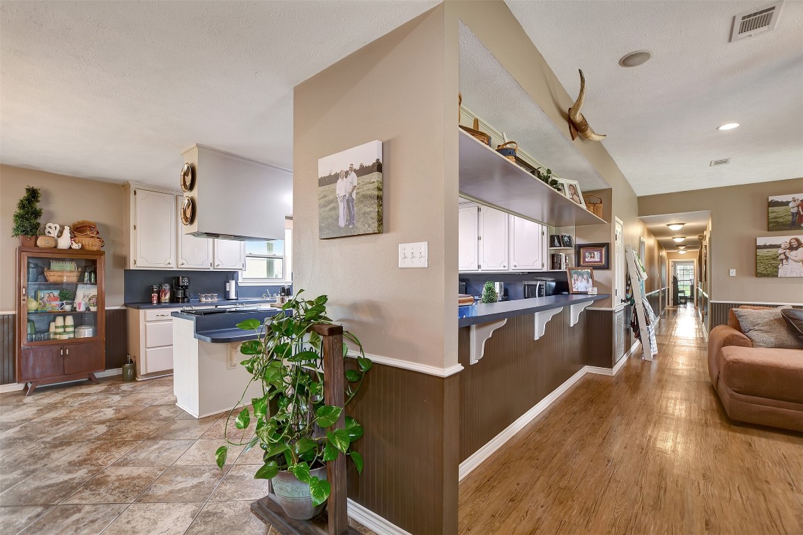 599 County Road 295 Garrison, TX 75946 - Photo 12 of 50 a kitchen with counter top space and wooden floor