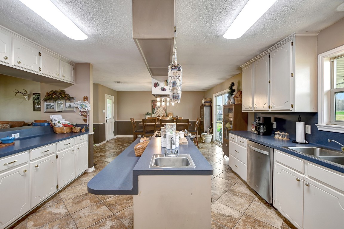 599 County Road 295 Garrison, TX 75946 - Photo 16 of 50 a large kitchen with stainless steel appliances granite countertop a lot of counter space and wooden floors