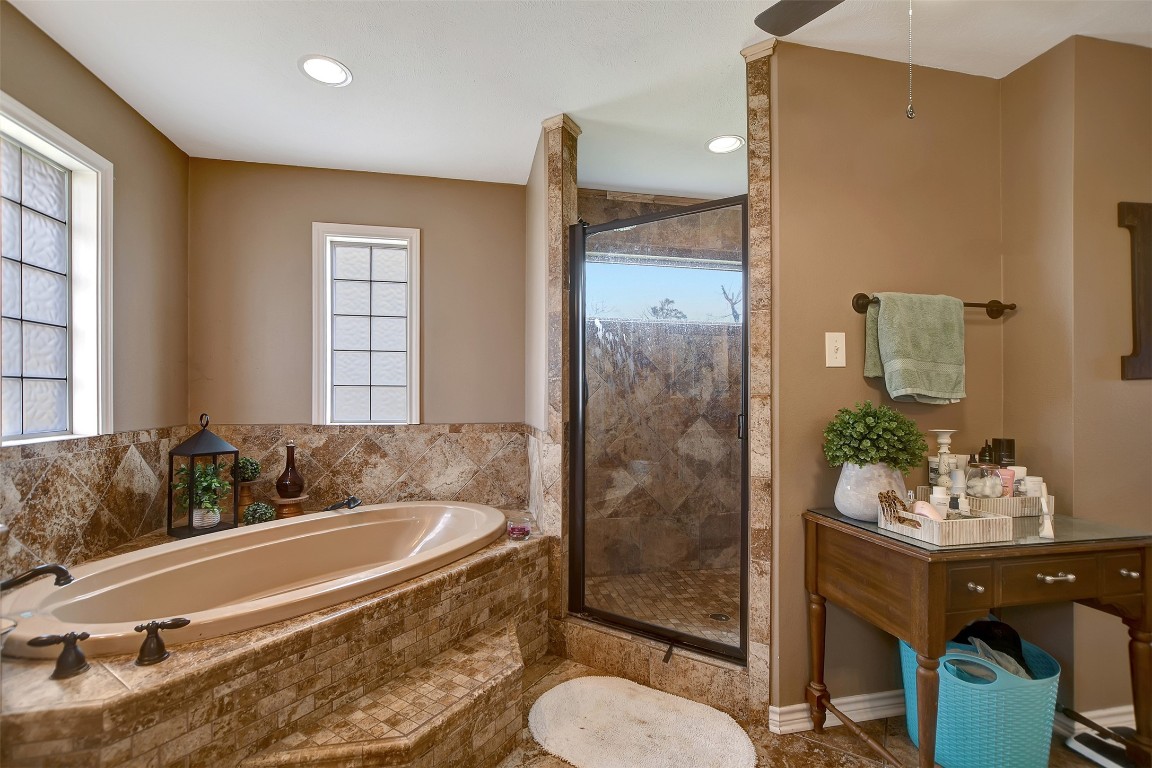 599 County Road 295 Garrison, TX 75946 - Photo 24 of 50 a spacious bathroom with a granite countertop tub sink and mirror