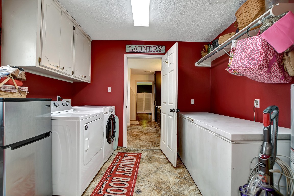 599 County Road 295 Garrison, TX 75946 - Photo 33 of 50 a utility room with dryer and washer
