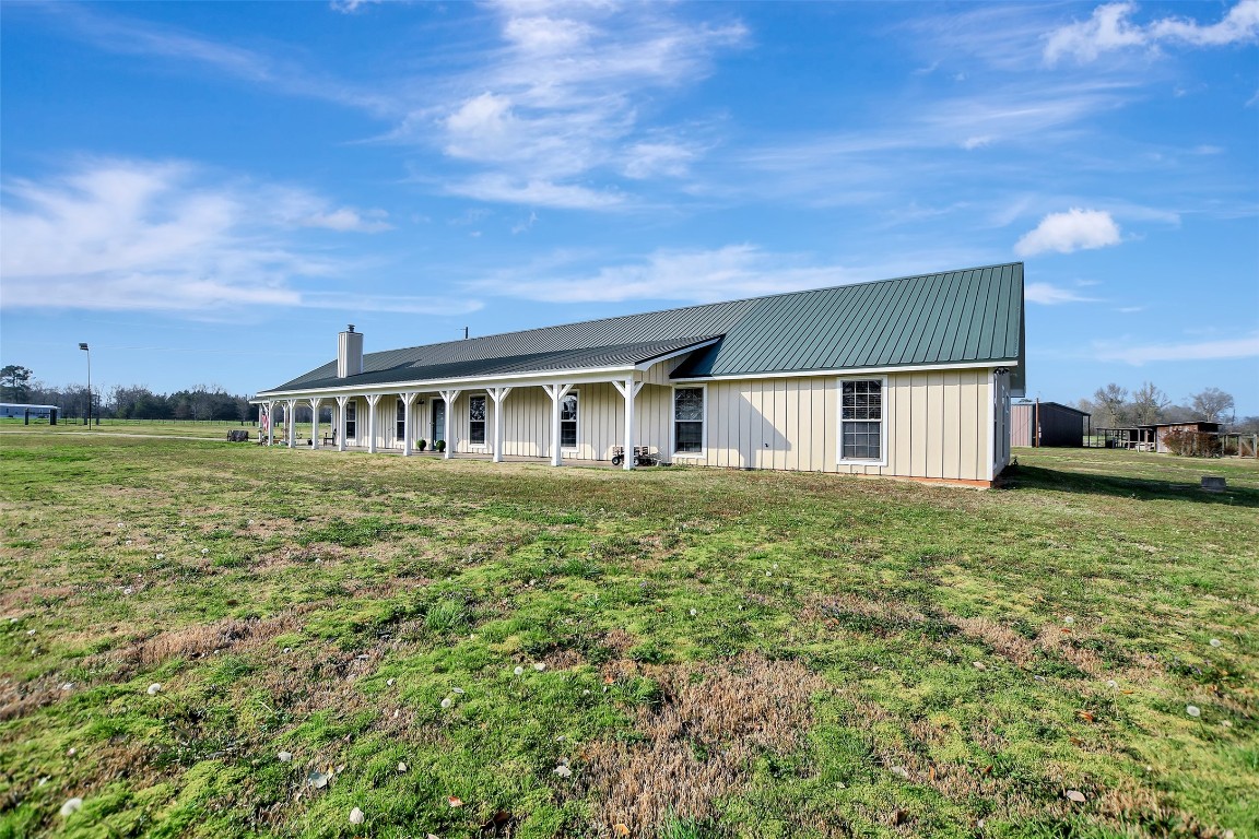599 County Road 295 Garrison, TX 75946 - Photo 4 of 50 a front view of a house with a yard