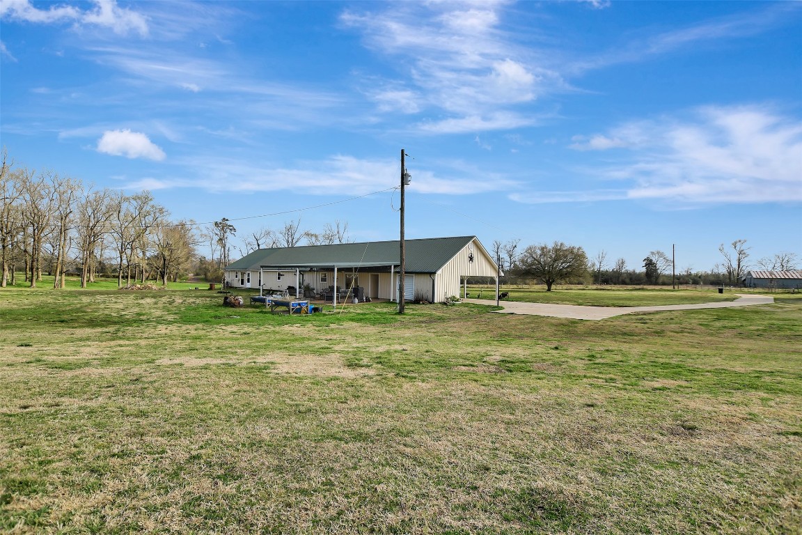 599 County Road 295 Garrison, TX 75946 - Photo 43 of 50 a view of a house with a yard