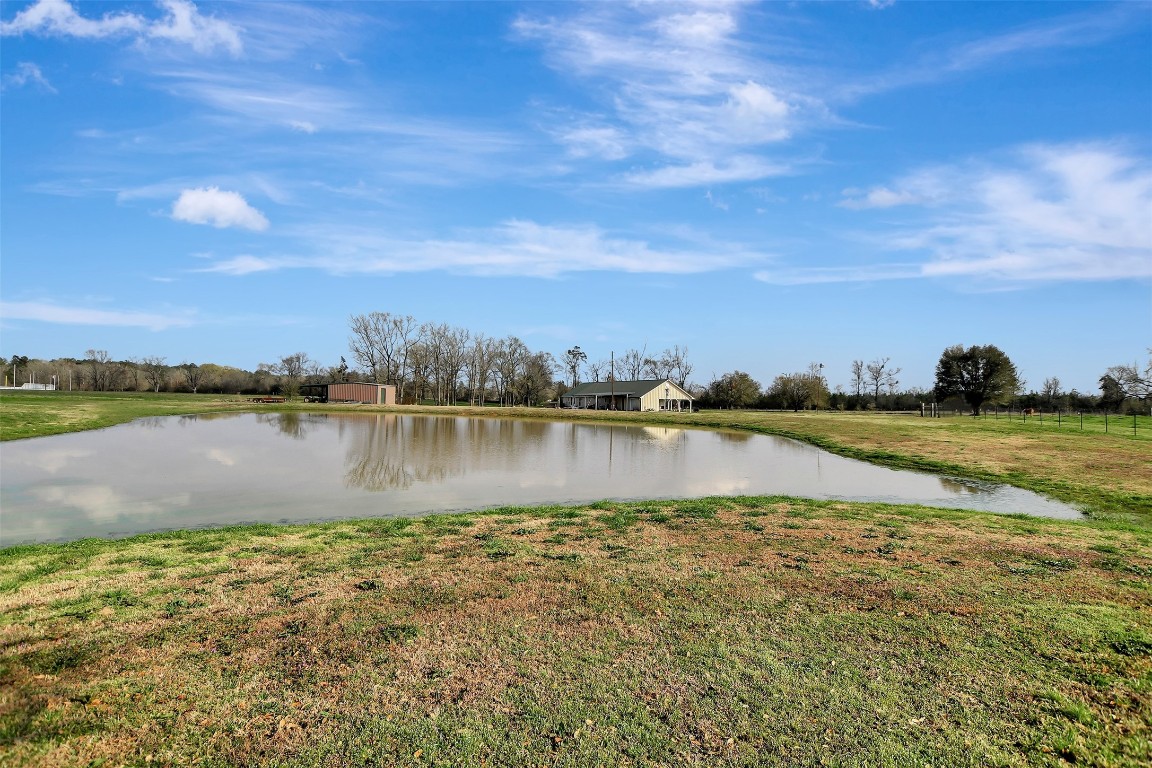 599 County Road 295 Garrison, TX 75946 - Photo 45 of 50 a view of a lake with houses in the background