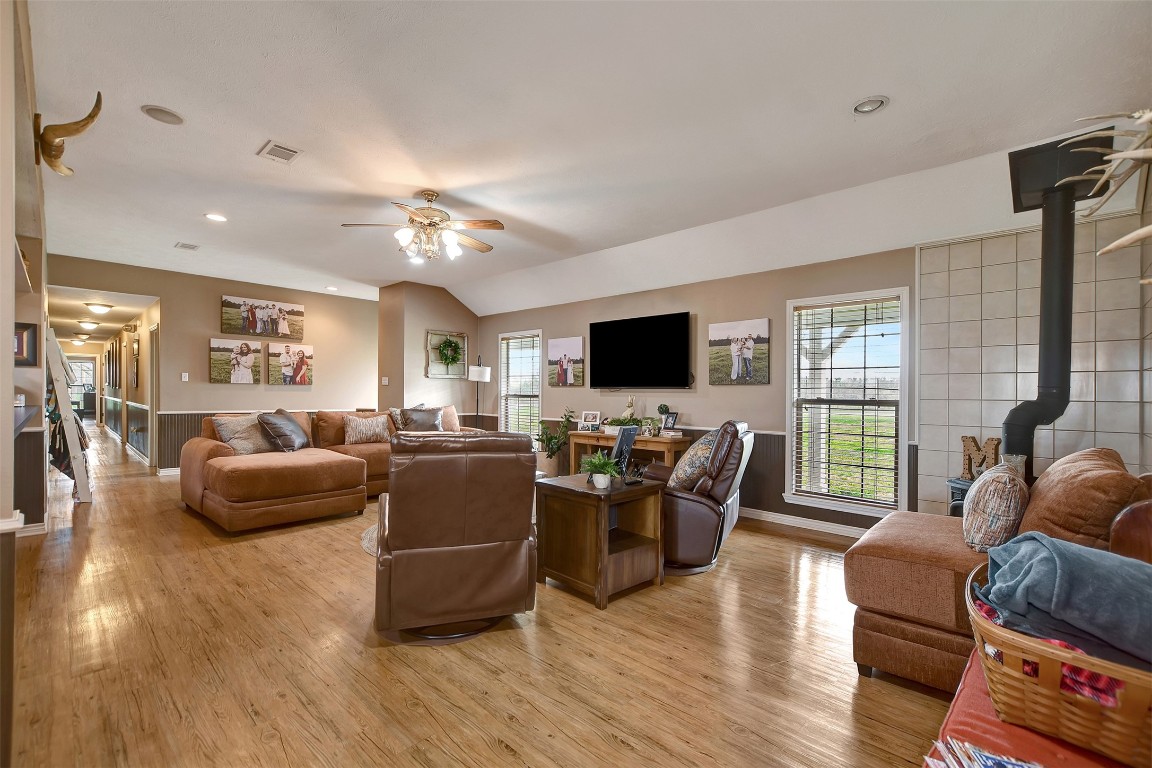 599 County Road 295 Garrison, TX 75946 - Photo 8 of 50 a living room with furniture a ceiling fan and a flat screen tv