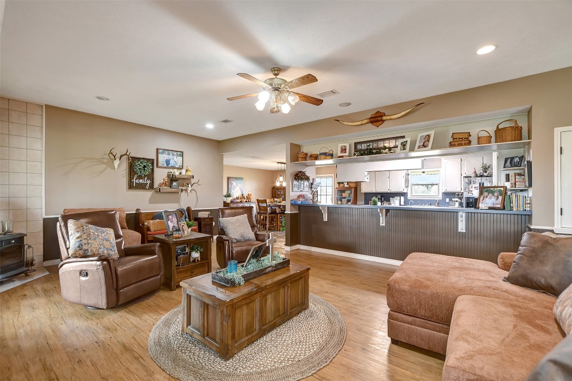 599 County Road 295 Garrison, TX 75946 - Photo 9 of 50 a living room with furniture kitchen view and a chandelier