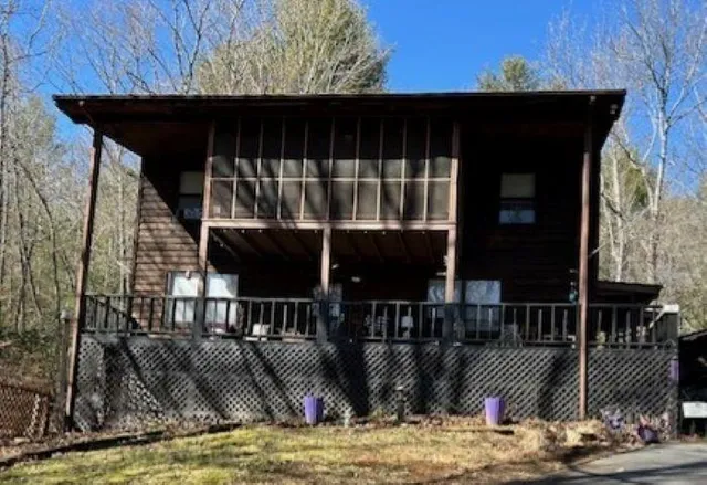 a view of house with backyard porch and furniture