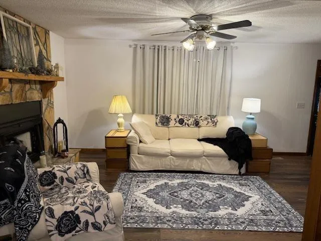 a living room with furniture fireplace and a table