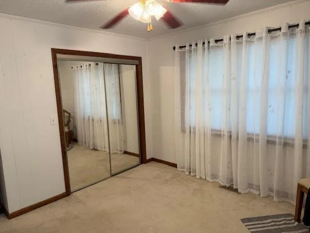 a view of a bathroom with a glass door and shower
