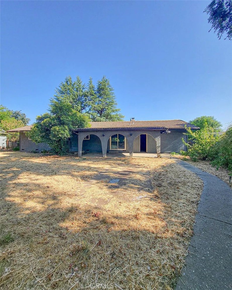 23080 Clement Street Red Bluff, CA 96080 - Photo 2 of 11 a front view of a house with a yard