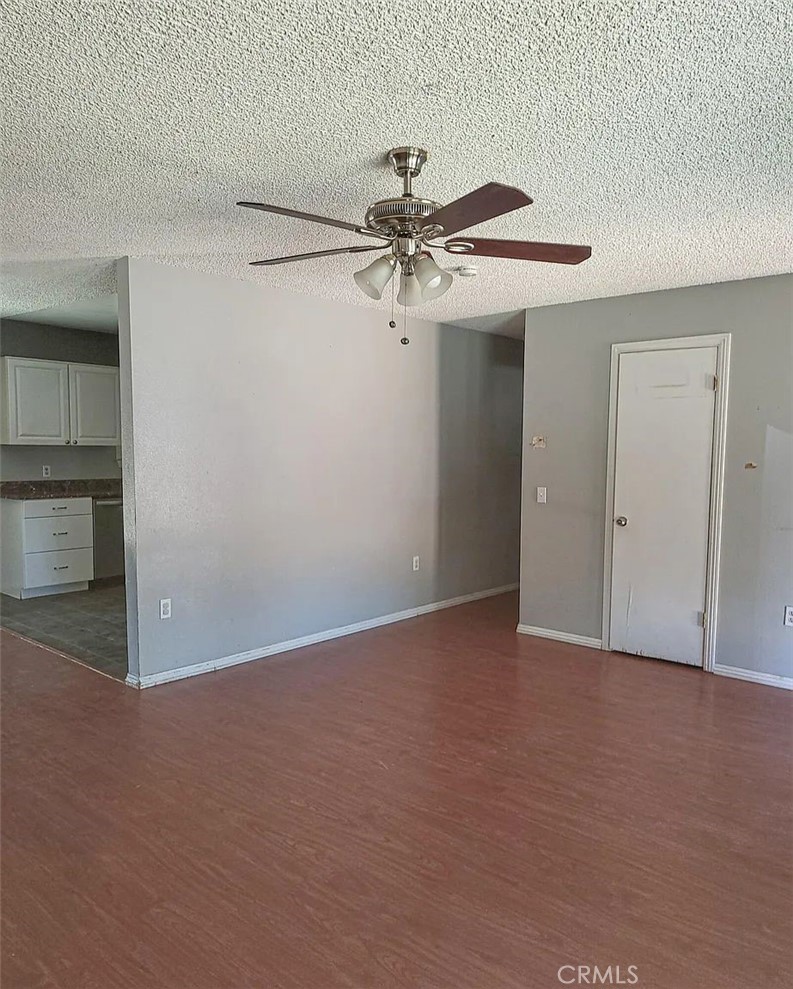 23080 Clement Street Red Bluff, CA 96080 - Photo 6 of 11 a view of a room with an empty space and a ceiling fan