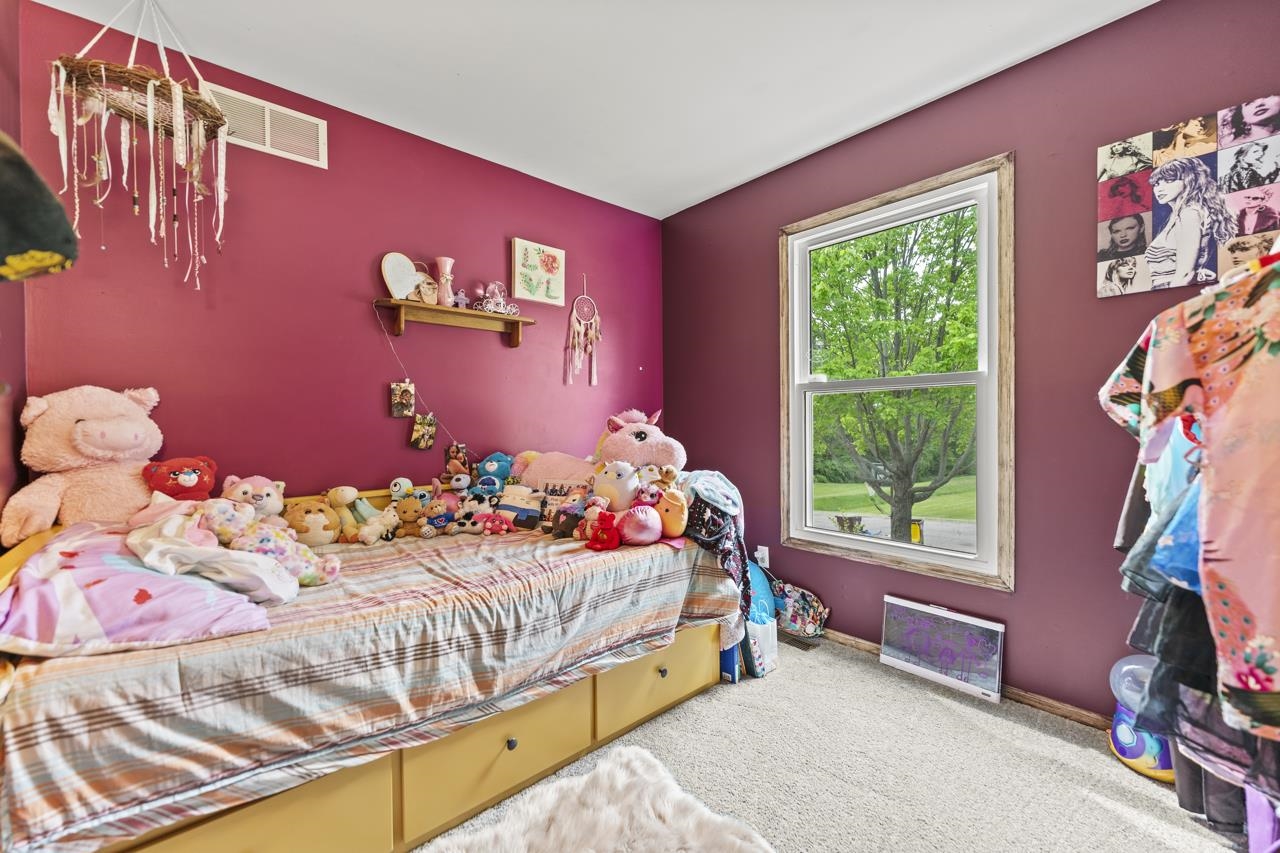 1084 Winborne Road Lake Summerset, IL 61019 - Photo 14 of 27 a bedroom with a bed and a window