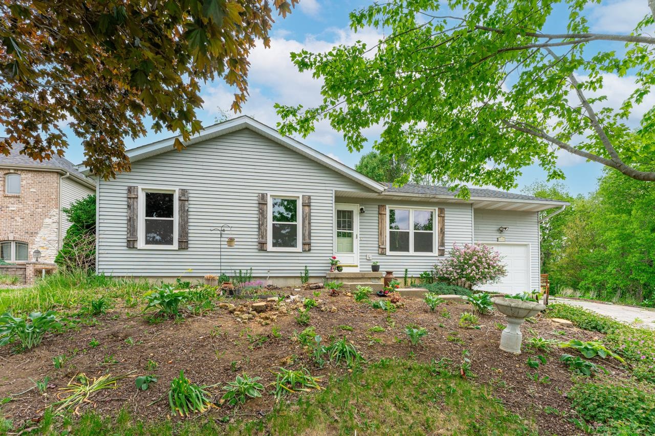 1084 Winborne Road Lake Summerset, IL 61019 - Photo 25 of 27 a house with trees in the background