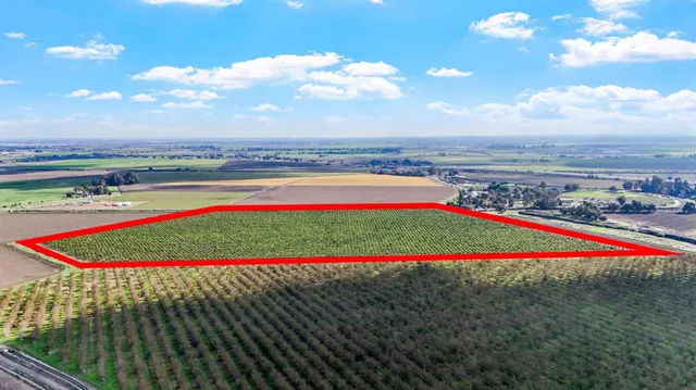 a view of a yard with swimming pool and an outdoor seating
