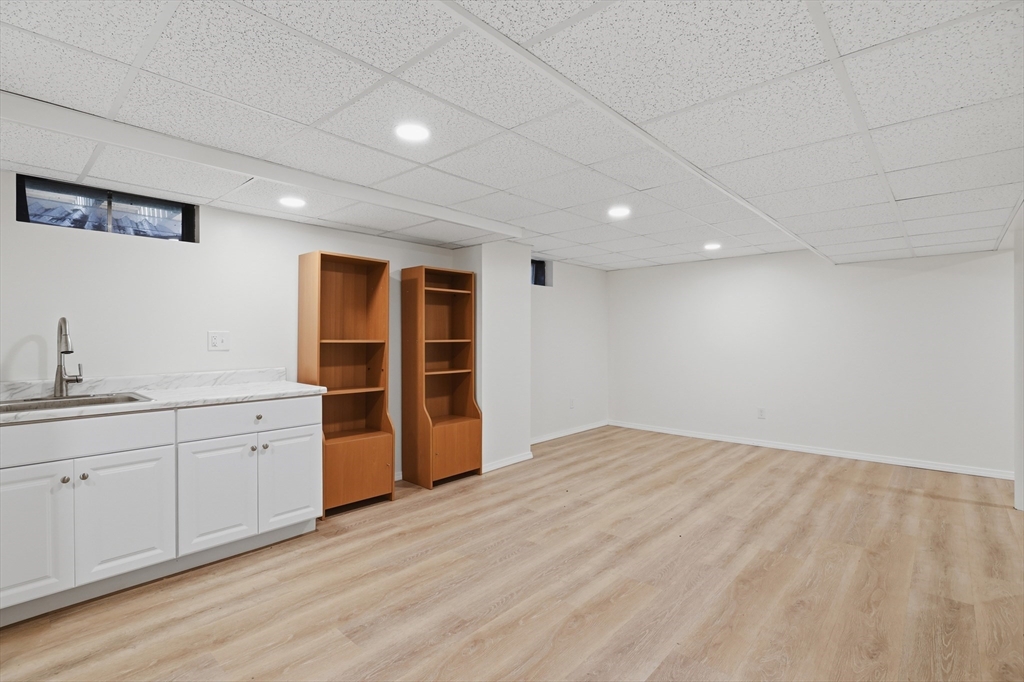 61 Indian Head Road Framingham, MA 01701 - Photo 33 of 42 a view of an empty room with a window and cabinet
