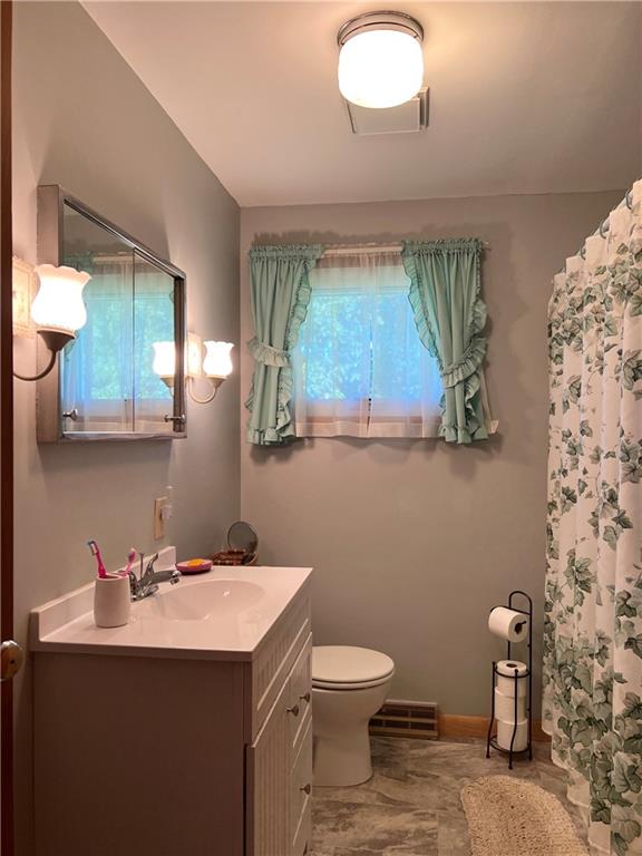 119 Walnut Street Apollo, PA 15613 - Photo 14 of 26 a bathroom with a toilet sink and mirror