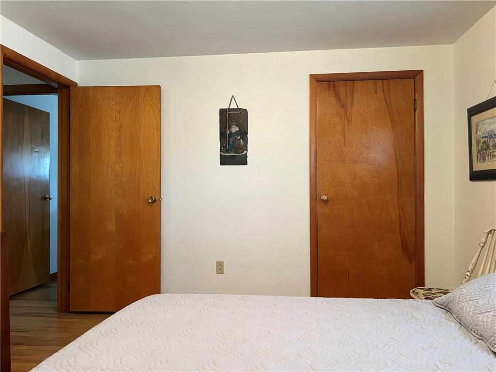 119 Walnut Street Apollo, PA 15613 - Photo 16 of 26 a bedroom with a bed and wooden floor