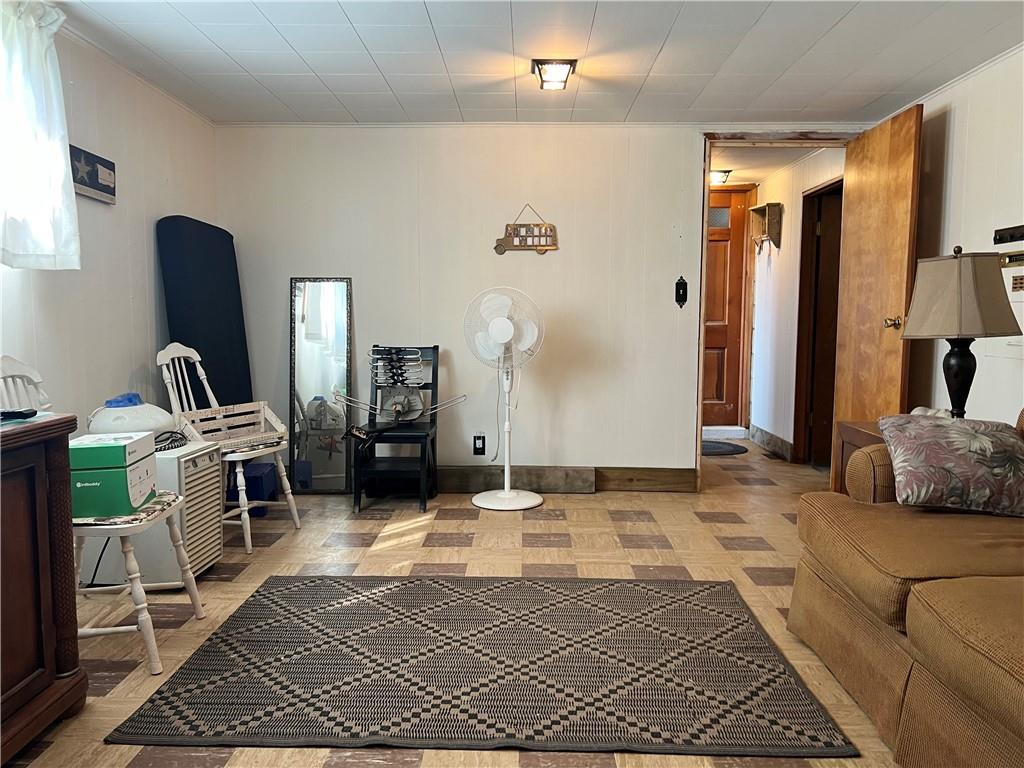 119 Walnut Street Apollo, PA 15613 - Photo 19 of 26 a bedroom with a bed a mirror and dresser