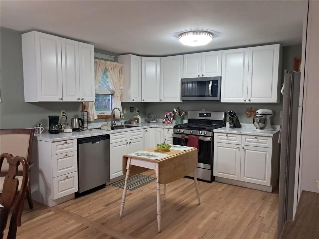 119 Walnut Street Apollo, PA 15613 - Photo 2 of 26 a kitchen with a stove a sink and white cabinets