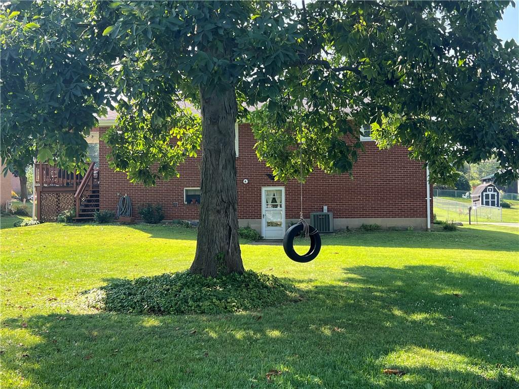 119 Walnut Street Apollo, PA 15613 - Photo 23 of 26 a swimming pool with some trees in the background