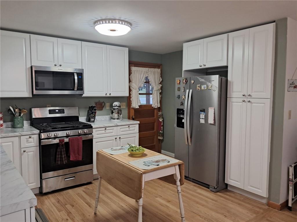 119 Walnut Street Apollo, PA 15613 - Photo 4 of 26 a kitchen with stainless steel appliances a stove microwave and refrigerator
