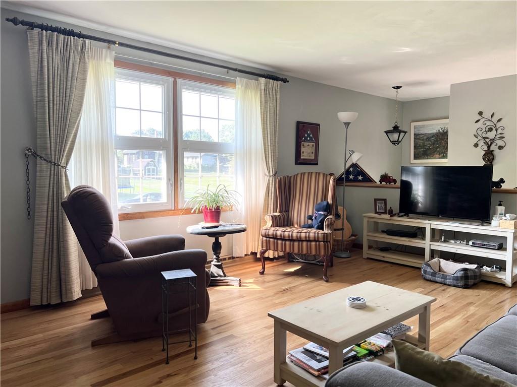 119 Walnut Street Apollo, PA 15613 - Photo 8 of 26 a living room with furniture and a flat screen tv