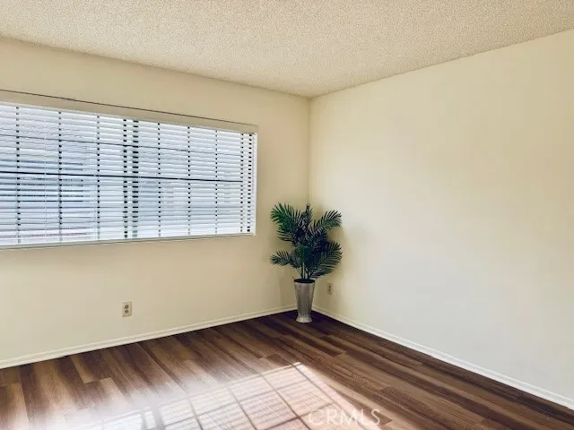 a view of an empty room and a window