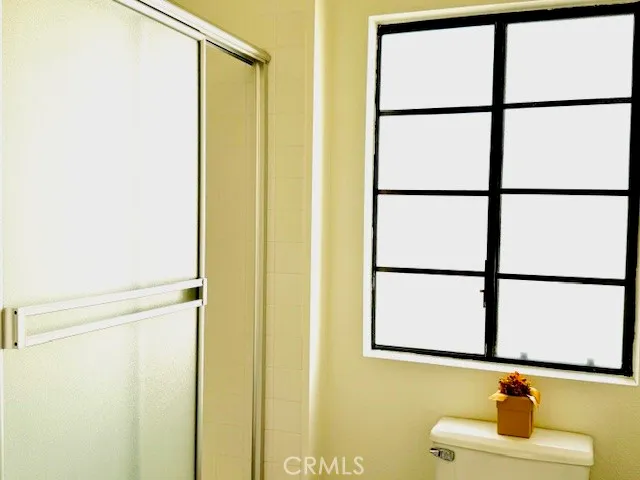 a bathroom with a window shower