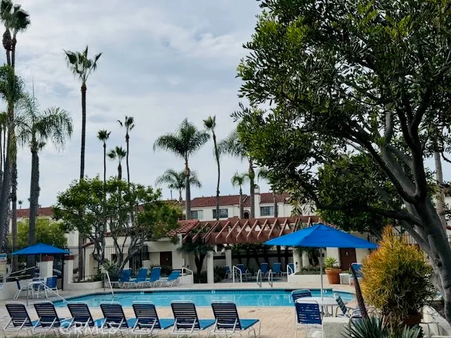 a front view of a house with yard and outdoor seating