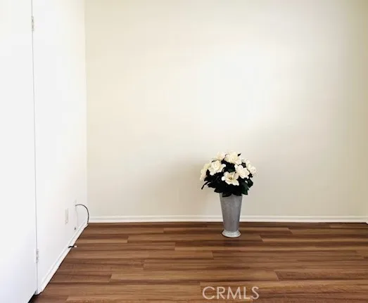 a view of a hallway with a flower pot
