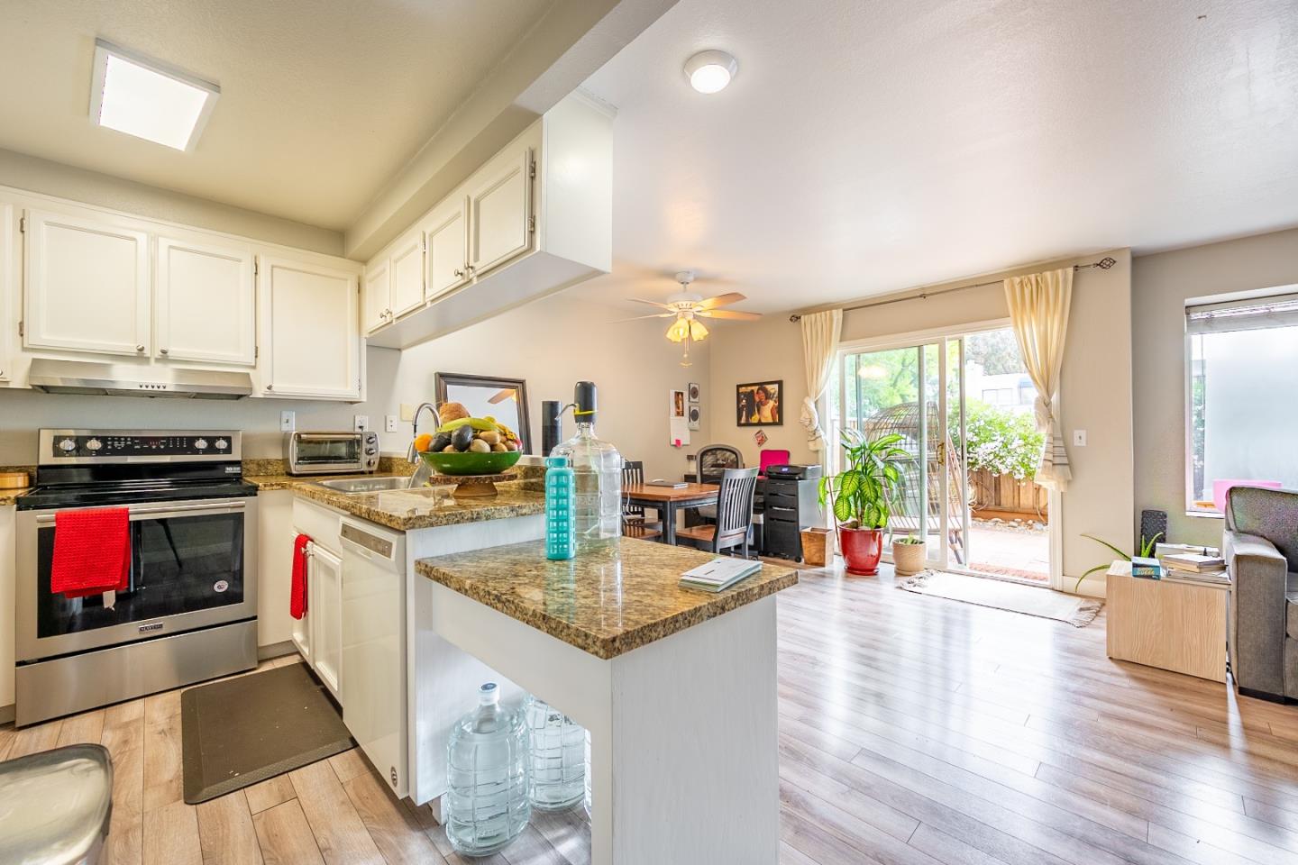 71 Redding Road Campbell, CA 95008 - Photo 7 of 20 a kitchen with stainless steel appliances granite countertop a stove a sink and a refrigerator