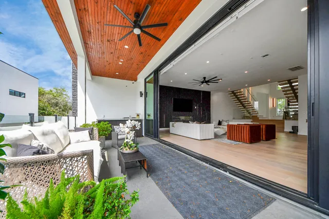 a lobby with furniture and a potted plant
