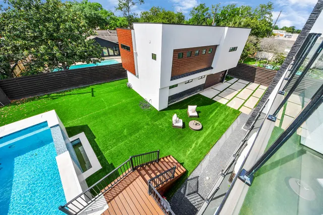 a view of a house with a yard patio and fire pit