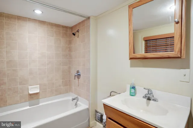 a bathroom with a sink and a bathtub