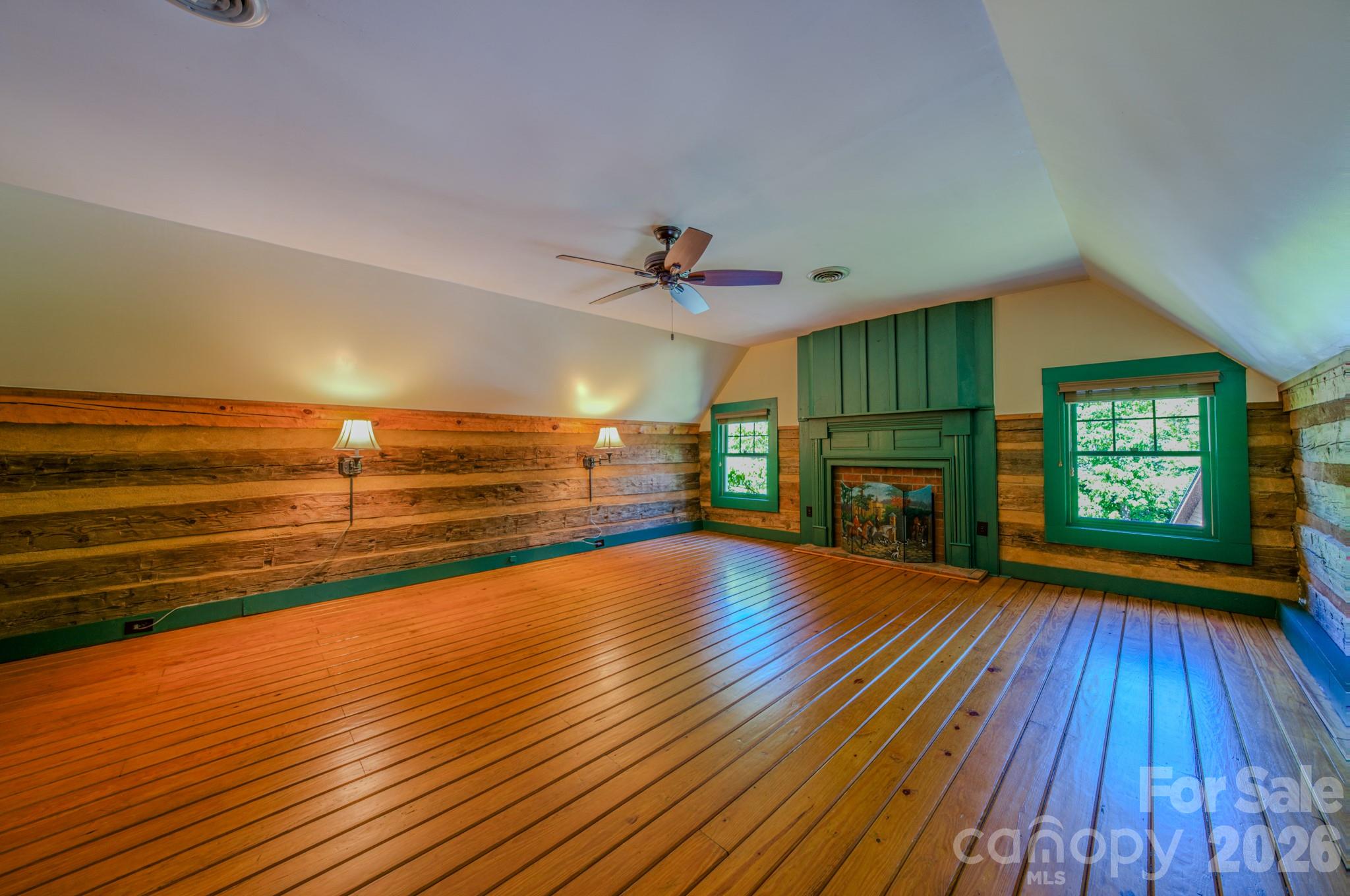 75 Old Gap Creek Road Fairview, NC 28730 - Photo 25 of 43 a view of empty room with wooden floor and fireplace