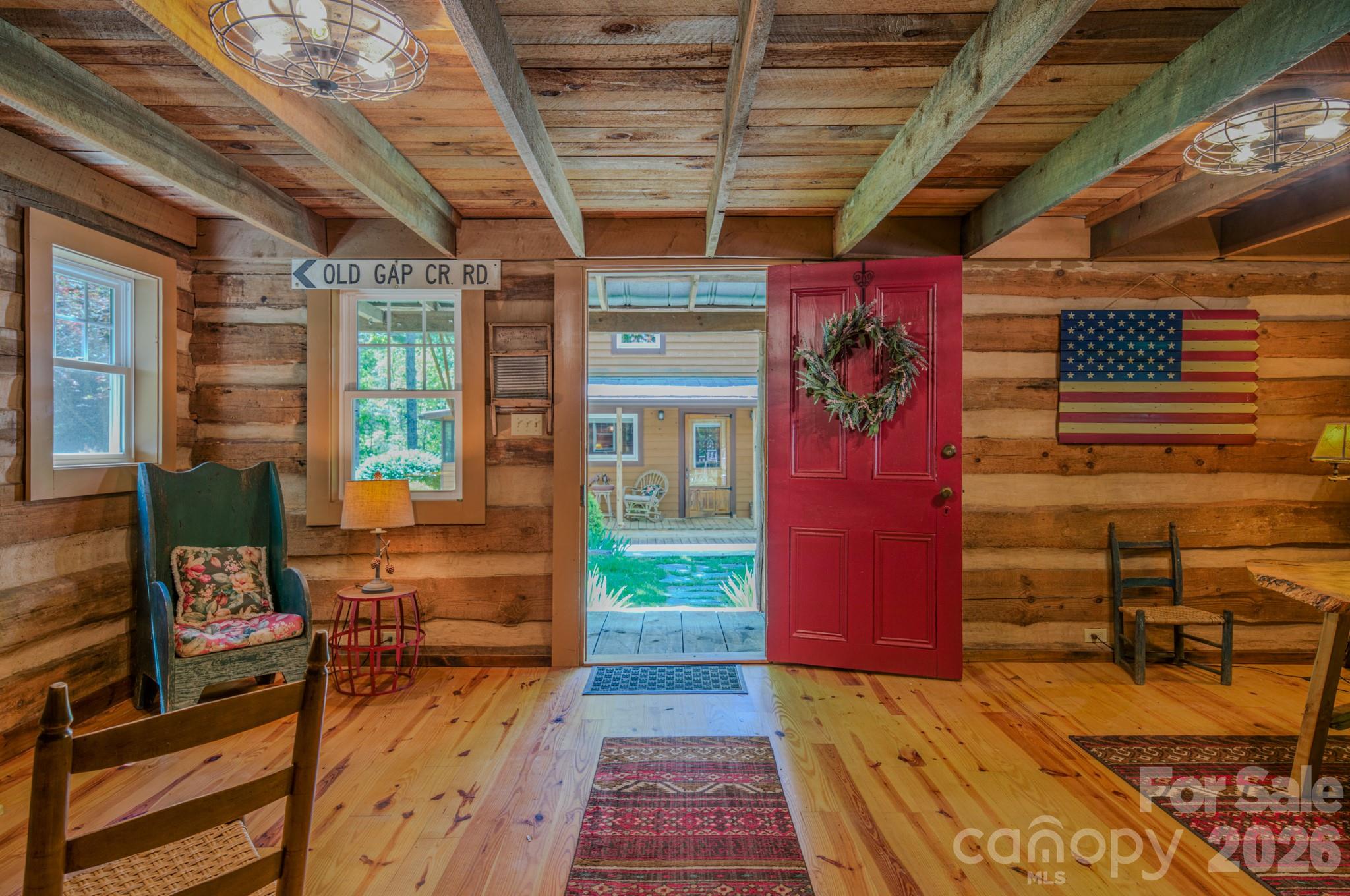 75 Old Gap Creek Road Fairview, NC 28730 - Photo 35 of 43 a view of a porch with a table and chairs