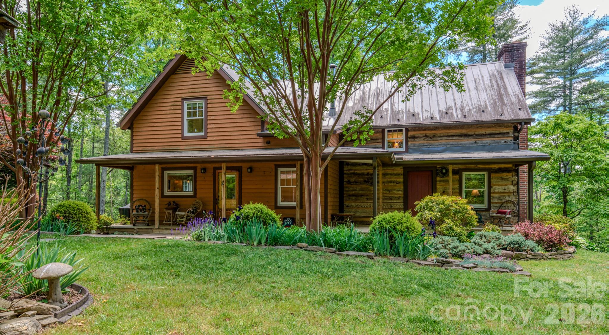75 Old Gap Creek Road Fairview, NC 28730 - Photo 7 of 43 a front view of a house with garden
