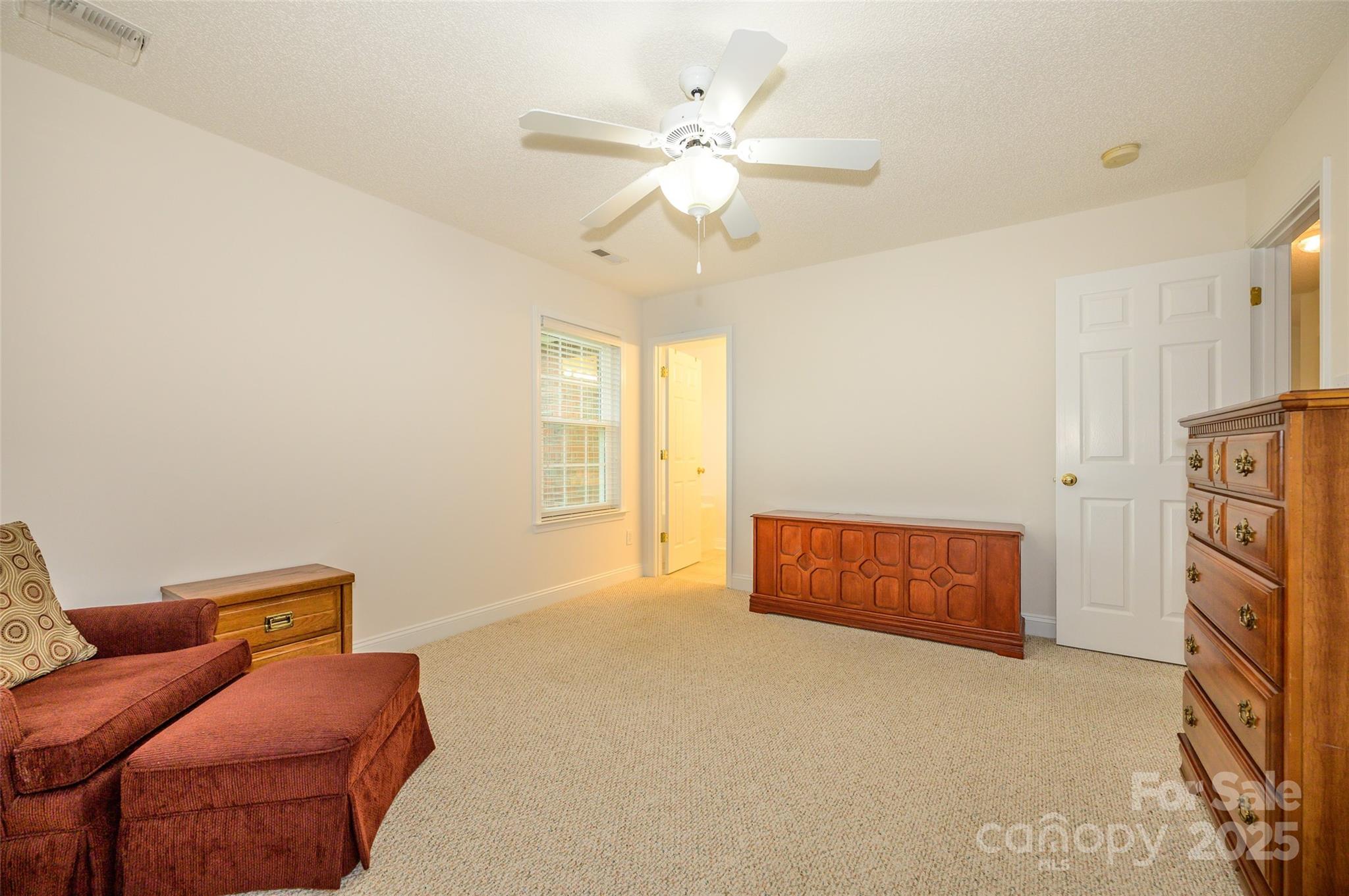 12617 Hill Pine Road Midland, NC 28107 - Photo 18 of 42 a living room with furniture and a ceiling fan
