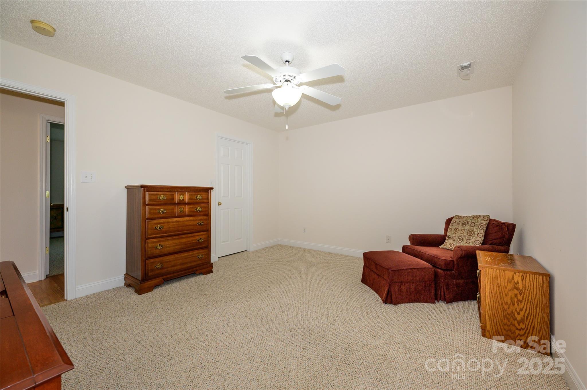 12617 Hill Pine Road Midland, NC 28107 - Photo 19 of 42 a living room with furniture and a ceiling fan