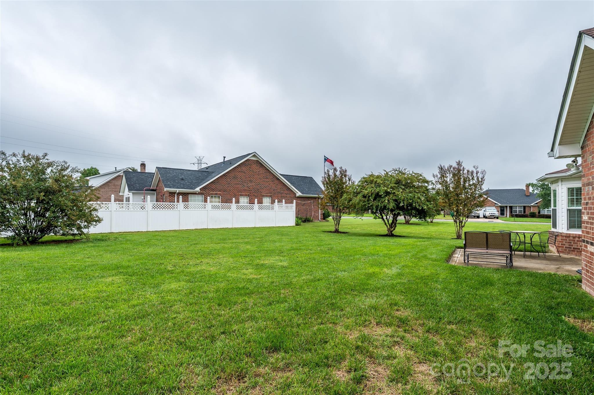 12617 Hill Pine Road Midland, NC 28107 - Photo 26 of 42 a view of a house with a big yard potted plants and large tree