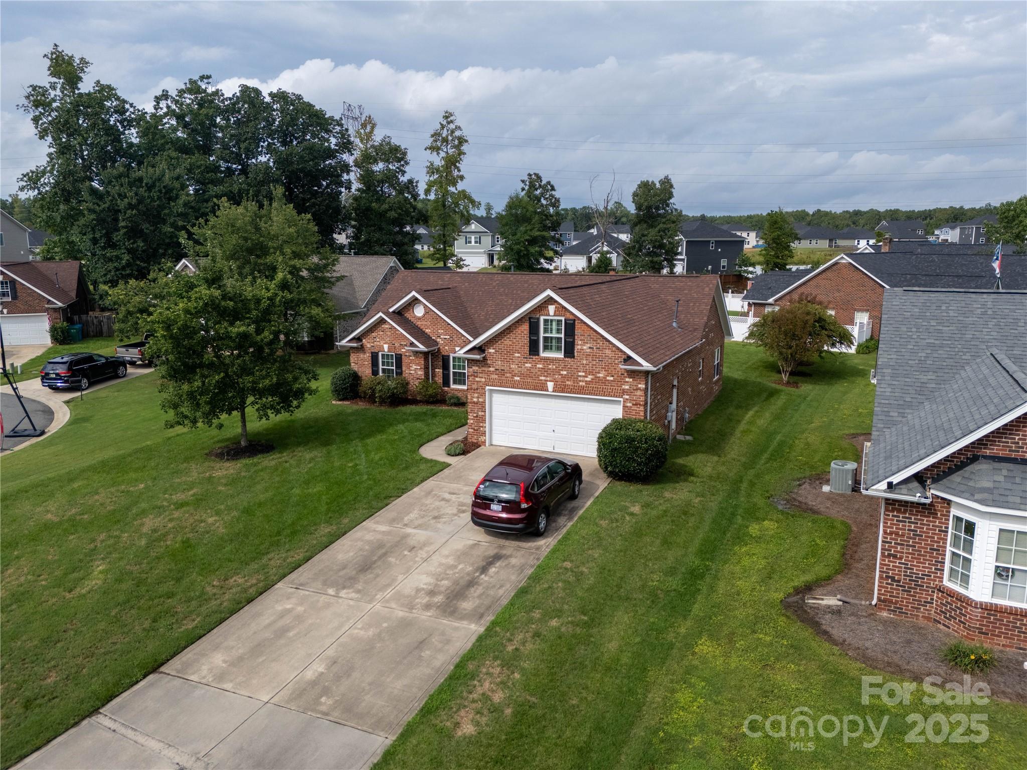 12617 Hill Pine Road Midland, NC 28107 - Photo 30 of 42 an aerial view of multiple houses with yard
