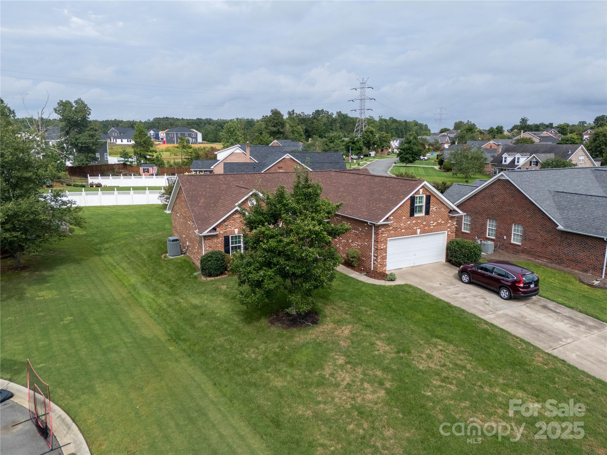 12617 Hill Pine Road Midland, NC 28107 - Photo 31 of 42 an aerial view of residential houses with outdoor space and trees