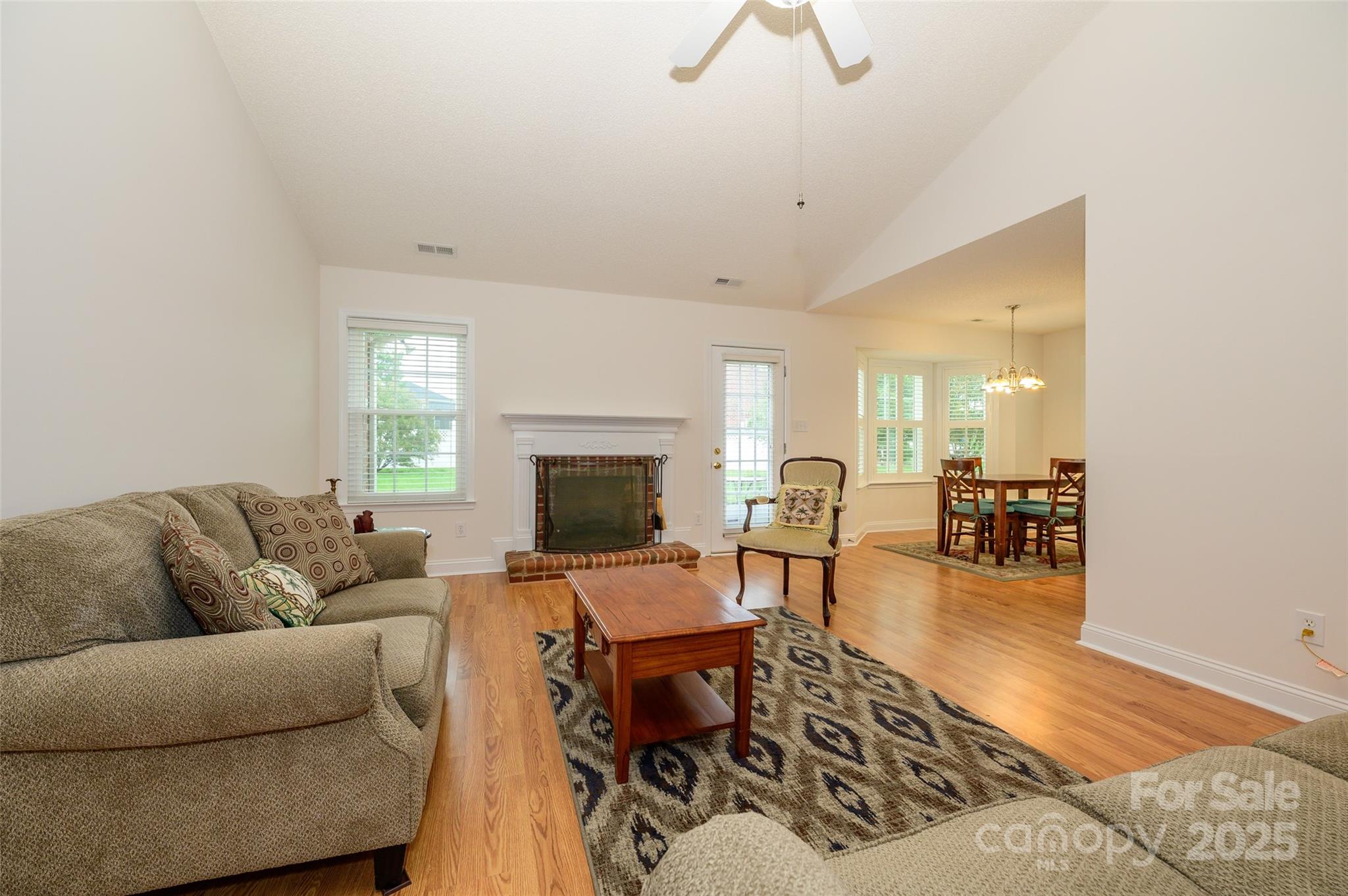 12617 Hill Pine Road Midland, NC 28107 - Photo 4 of 42 a living room with furniture and a fireplace